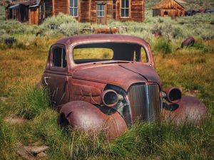 Preview wallpaper car, retro, rust, grass, house, village