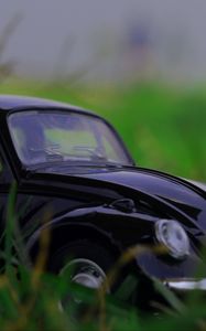 Preview wallpaper car, retro, typewriter, toy, grass