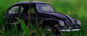 Preview wallpaper car, retro, typewriter, toy, grass