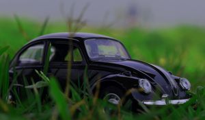 Preview wallpaper car, retro, typewriter, toy, grass