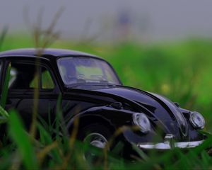 Preview wallpaper car, retro, typewriter, toy, grass