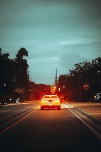 Preview wallpaper car, road, light, dusk, street