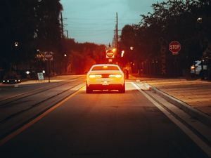 Preview wallpaper car, road, light, dusk, street