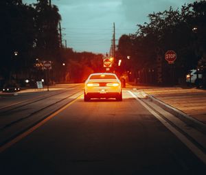 Preview wallpaper car, road, light, dusk, street