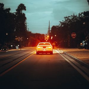 Preview wallpaper car, road, light, dusk, street