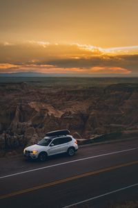 Preview wallpaper car, road, mountains, sunset, landscape