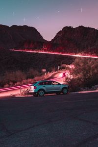 Preview wallpaper car, road, night, starry sky, hill