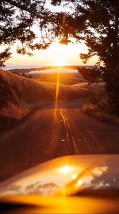 Preview wallpaper car, road, sunset, sunlight, nature