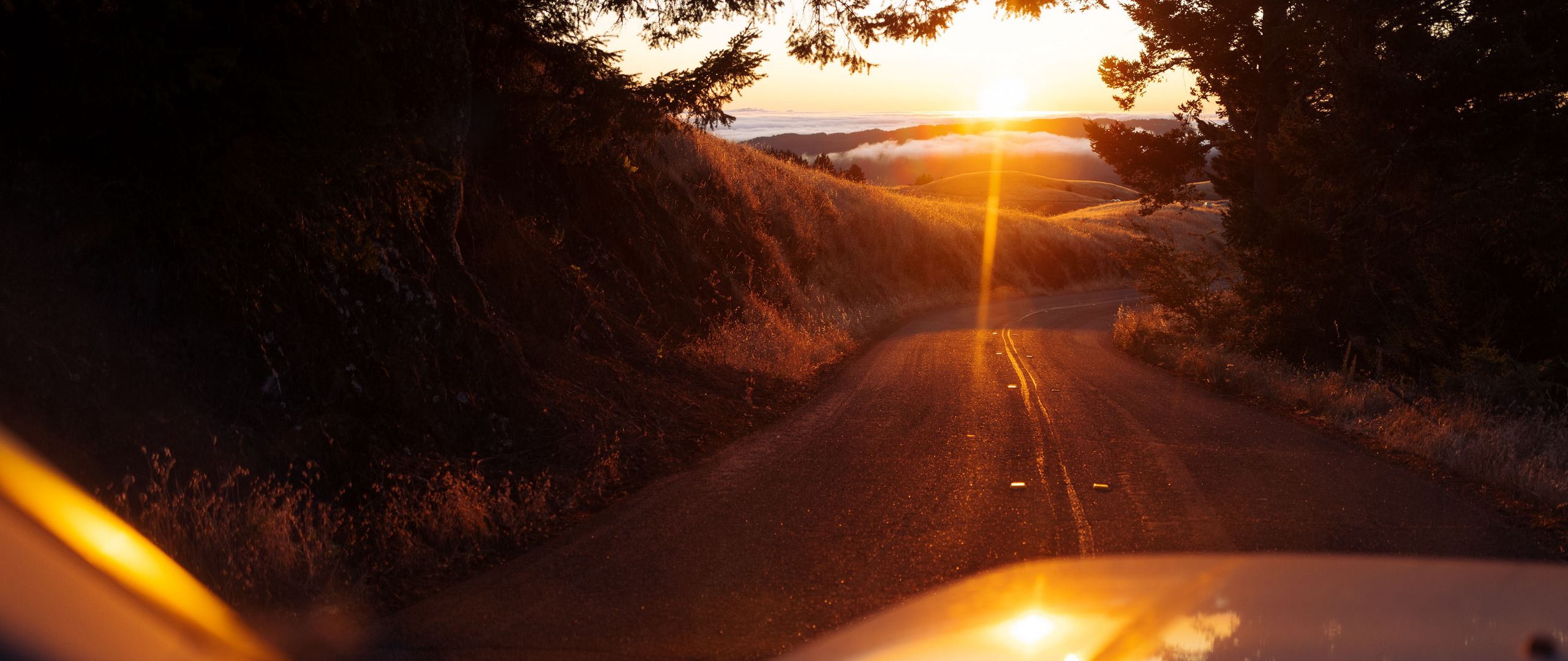 Download wallpaper 2560x1080 car, road, sunset, sunlight, nature dual