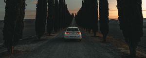Preview wallpaper car, road, trees, alley, twilight
