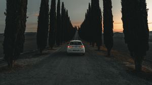 Preview wallpaper car, road, trees, alley, twilight