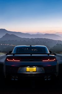 Preview wallpaper car, road, twilight, light, landscape