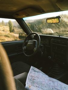 Preview wallpaper car, salon, steering wheel, map, travel