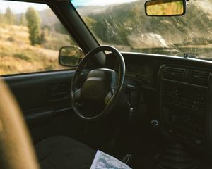 Preview wallpaper car, salon, steering wheel, map, travel