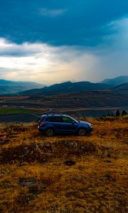 Preview wallpaper car, side view, grass, distance, valley