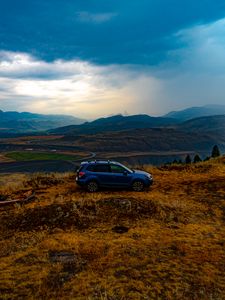 Preview wallpaper car, side view, grass, distance, valley