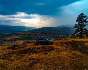 Preview wallpaper car, side view, grass, distance, valley