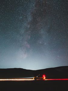 Preview wallpaper car, side view, hills, headlights, glow, night