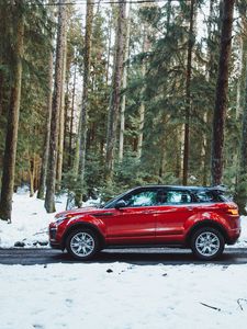 Preview wallpaper car, side view, red, road, forest, snowy