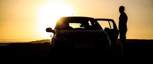 Preview wallpaper car, silhouette, dark, twilight, door, open