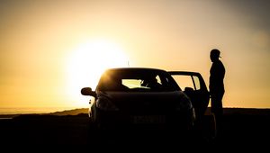 Preview wallpaper car, silhouette, dark, twilight, door, open