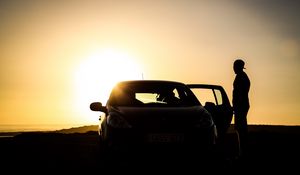 Preview wallpaper car, silhouette, dark, twilight, door, open