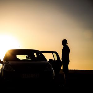 Preview wallpaper car, silhouette, dark, twilight, door, open