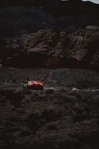 Preview wallpaper car, sports car, mountains, lights, relief, rocks