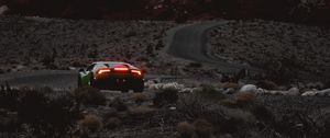 Preview wallpaper car, sports car, mountains, lights, relief, rocks