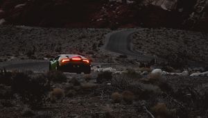 Preview wallpaper car, sports car, mountains, lights, relief, rocks