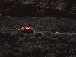 Preview wallpaper car, sports car, mountains, lights, relief, rocks