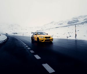 Preview wallpaper car, sports car, yellow, road, snow