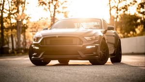 Preview wallpaper car, sportscar, black, front view, coupe, asphalt, sunlight