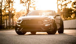 Preview wallpaper car, sportscar, black, front view, coupe, asphalt, sunlight