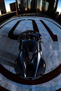 Preview wallpaper car, sportscar, black, aerial view, parking, city