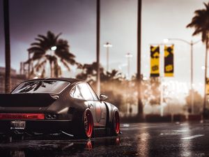 Preview wallpaper car, sportscar, black, wet, road