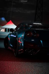 Preview wallpaper car, sportscar, dark, wet, rear view