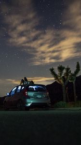 Preview wallpaper car, starry sky, man, loneliness, palm trees, solitude