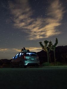 Preview wallpaper car, starry sky, man, loneliness, palm trees, solitude