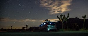 Preview wallpaper car, starry sky, man, loneliness, palm trees, solitude