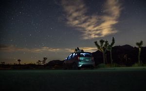 Preview wallpaper car, starry sky, man, loneliness, palm trees, solitude