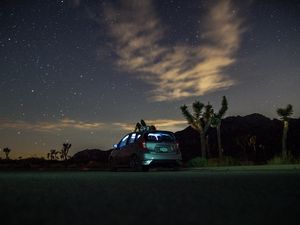 Preview wallpaper car, starry sky, man, loneliness, palm trees, solitude