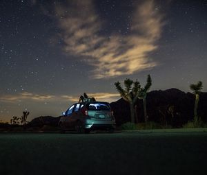 Preview wallpaper car, starry sky, man, loneliness, palm trees, solitude