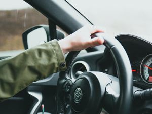 Preview wallpaper car, steering wheel, hand, driver