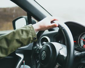 Preview wallpaper car, steering wheel, hand, driver