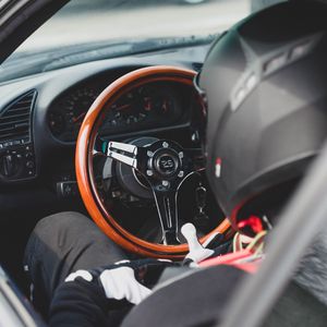 Preview wallpaper car, steering wheel, racer, helmet, salon