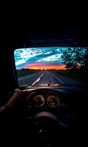 Preview wallpaper car, steering wheel, road, journey, sunset