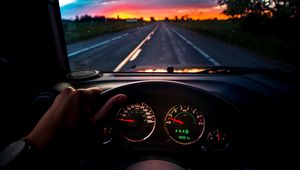 Preview wallpaper car, steering wheel, road, journey, sunset