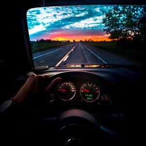 Preview wallpaper car, steering wheel, road, journey, sunset