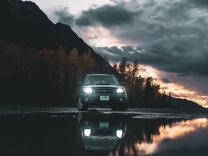 Preview wallpaper car, suv, black, water, reflection